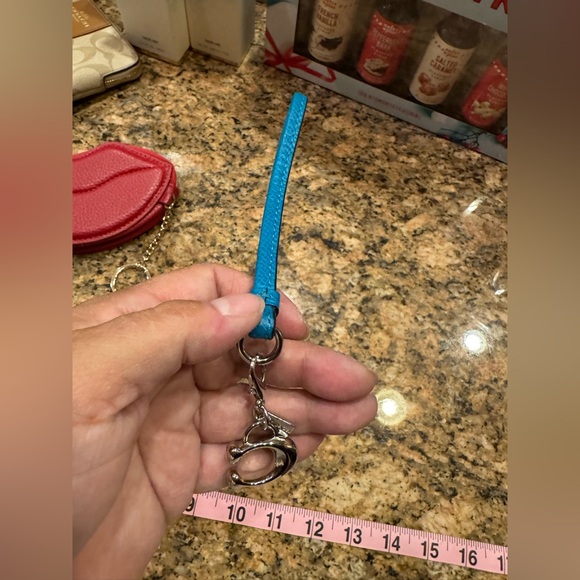 Coach Handbags - Coach teal leather wristlet keychain with a silver-tone Coach logo charm